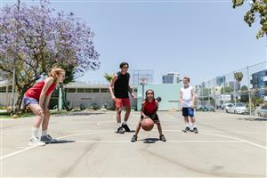 4 kids playing basketball